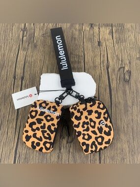 lululemon athletica Orange and Black Leopard Print Wristlet Pouch Set